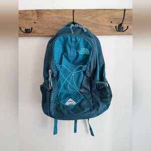 north face jester teal blue backpack with lots of pockets